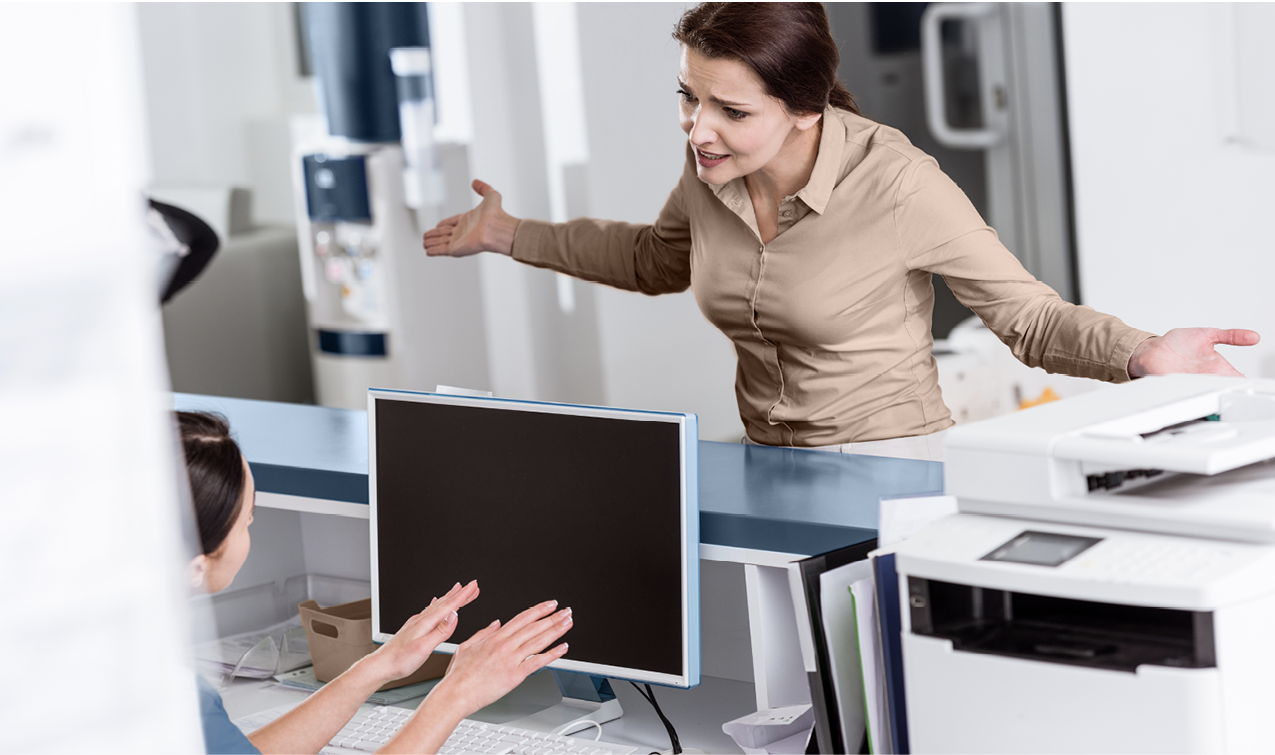 Photo of an upset client speaking to a CSR