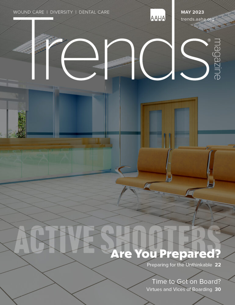 Cover of May 2023 Trends—Darkened photo of an empty veterinary waiting room
