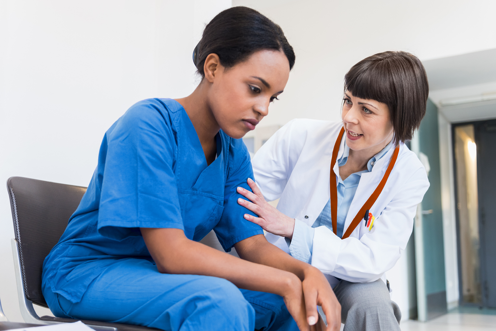Veterinarian is reassuring an upset technician