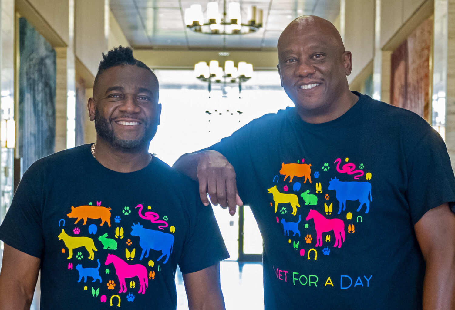 Critter Fixers stars Vernard Hodges, DVM, (left) and Terrence Ferguson, DVM. Both are wearing t-shirts that say 