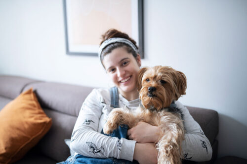 Owner holding dog
