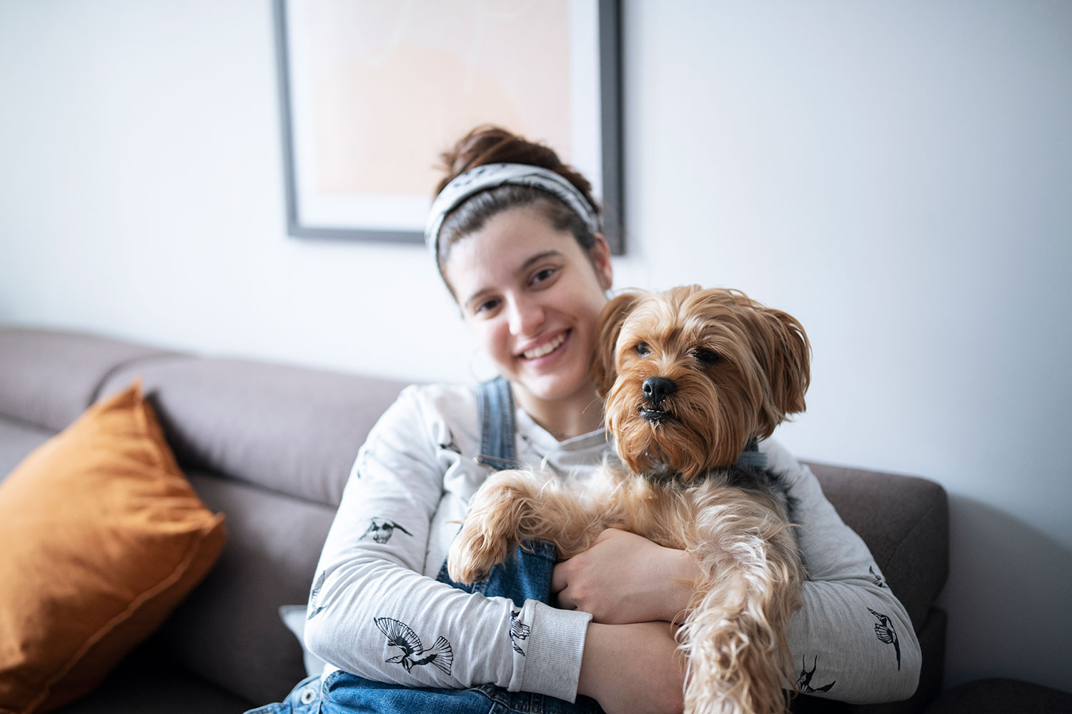 Owner holding dog