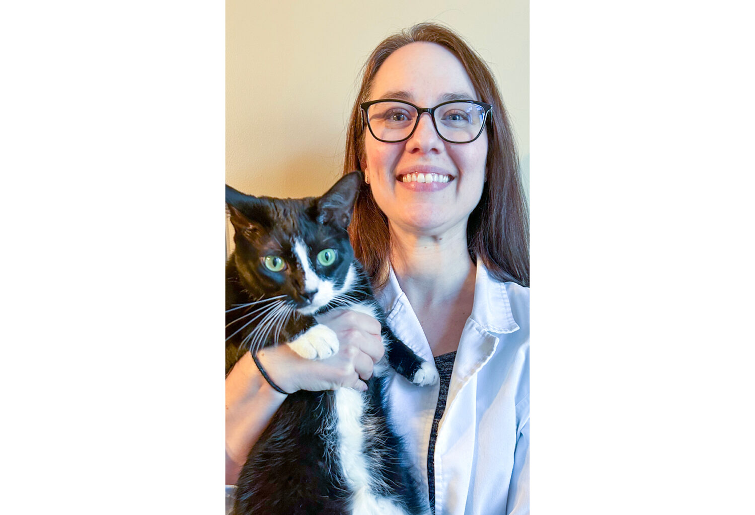 Photo of Melissa Mustillo, DVM, DABVP (Feline Practice), holding a cat.