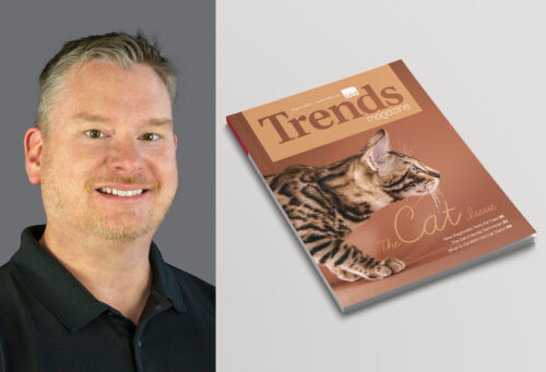 A photo of Trends editor, Ben Williams, next to a print issue of August 2024 Trends