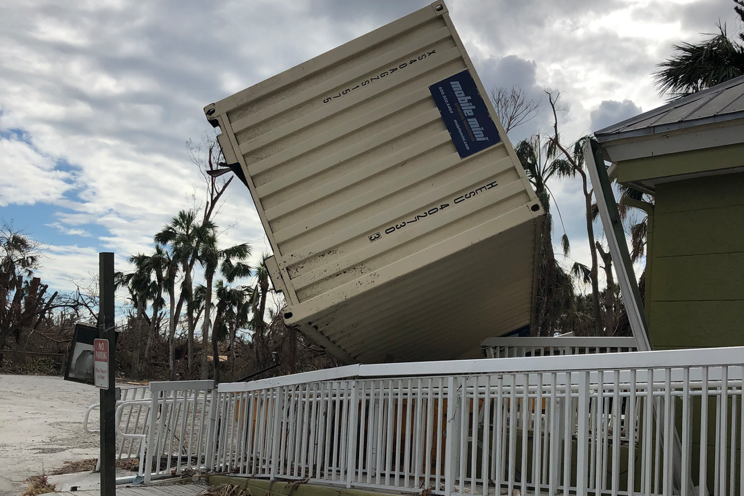 shipping container overturned due to storm damage from hurricane ian in 2022