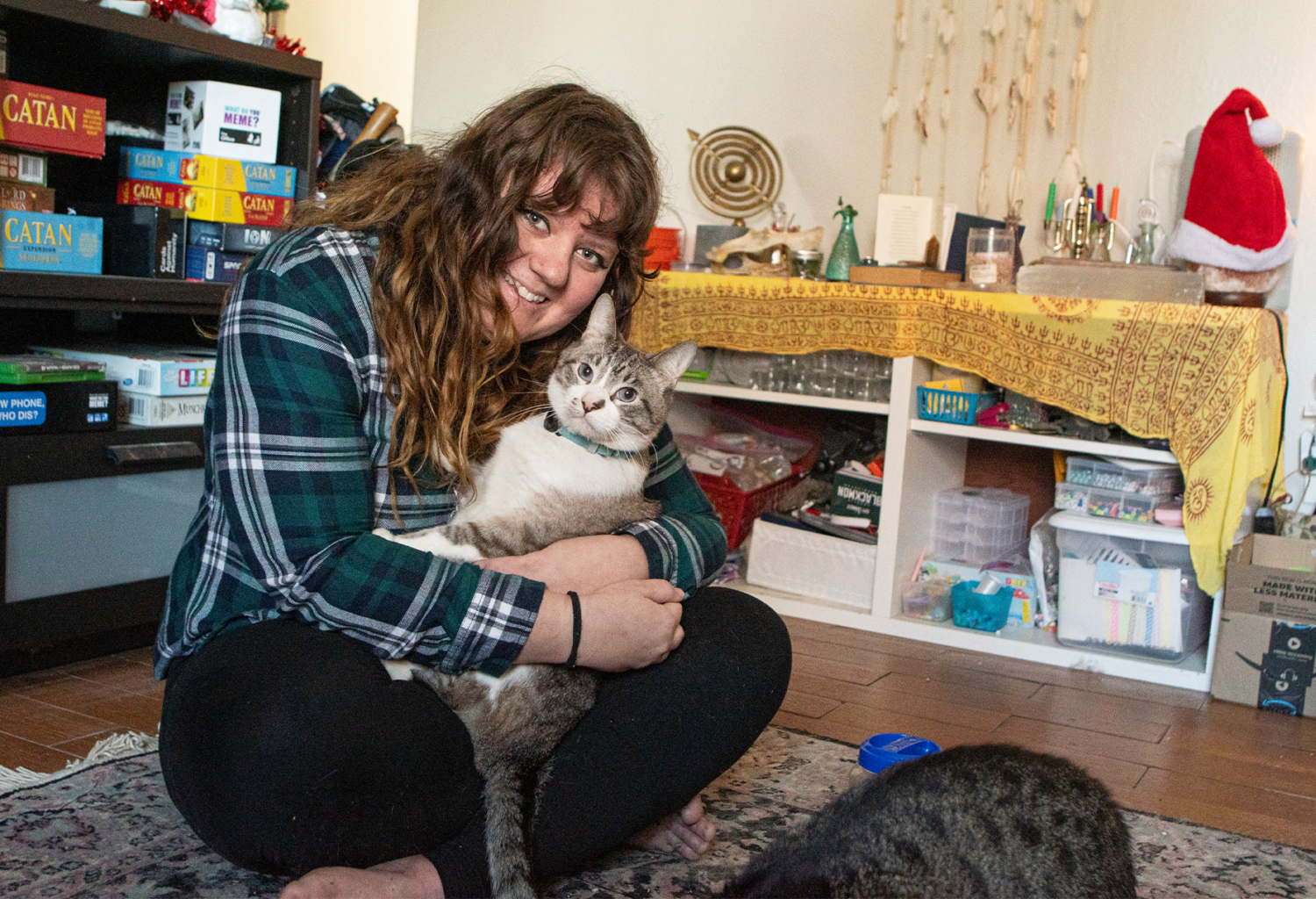Rachel Jones and her cat Quazi after being reunited thanks to a microchip