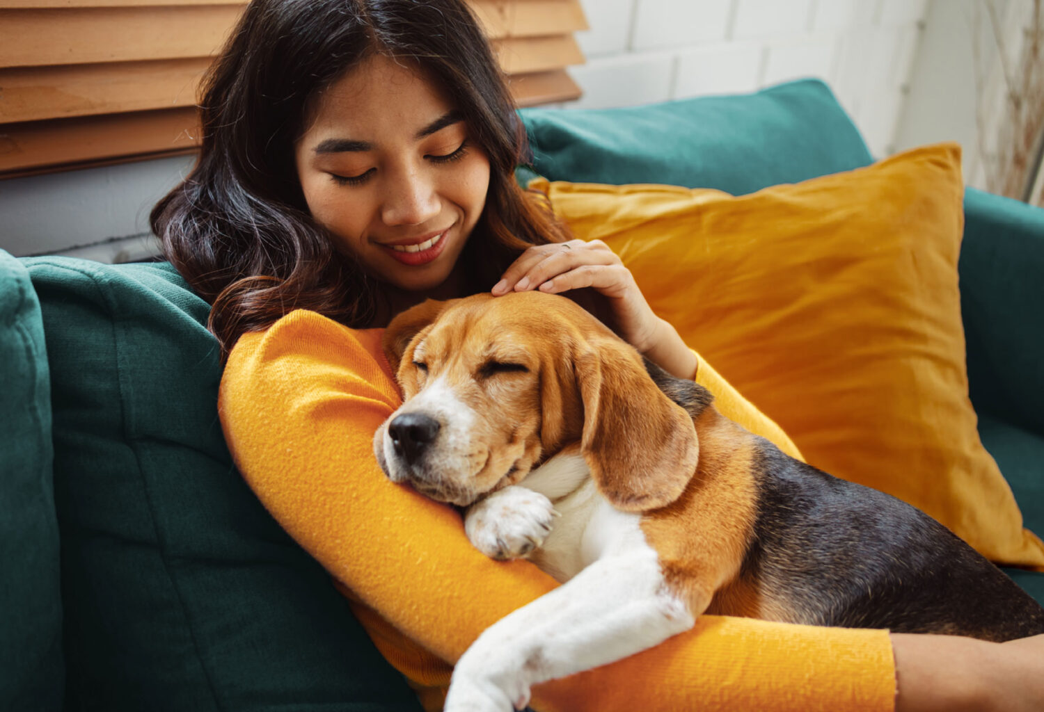 Woman holding her dog